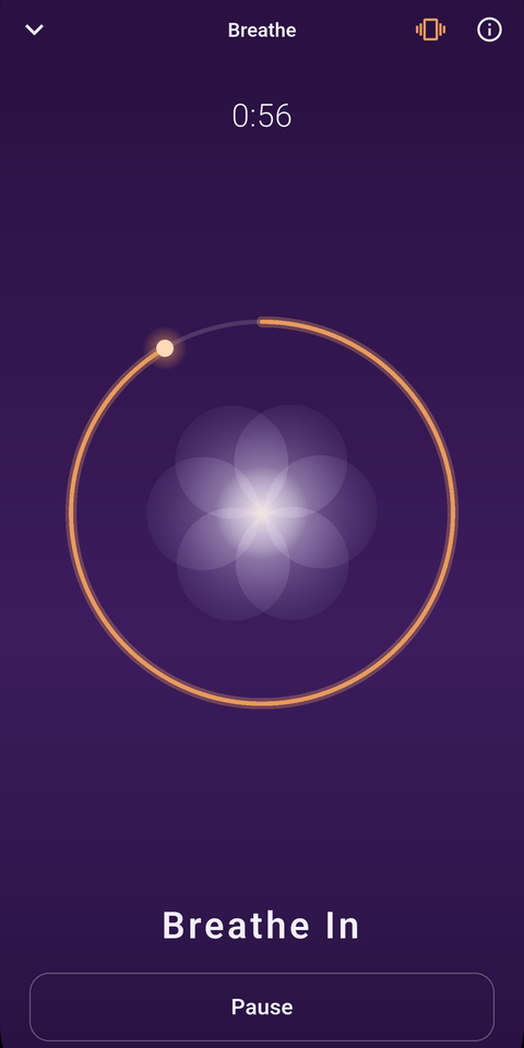 The MoodFire Breathe screen showing a glowing orb and a timed inhale, mid-session.